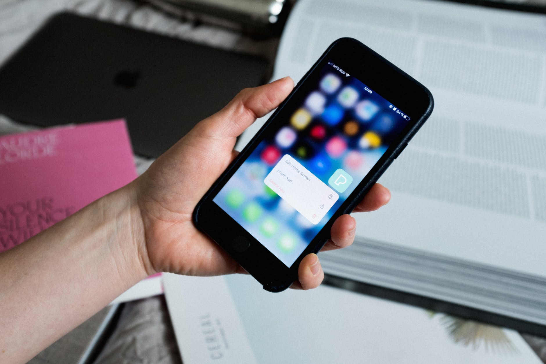 crop faceless person showing pop up window on smartphone screen